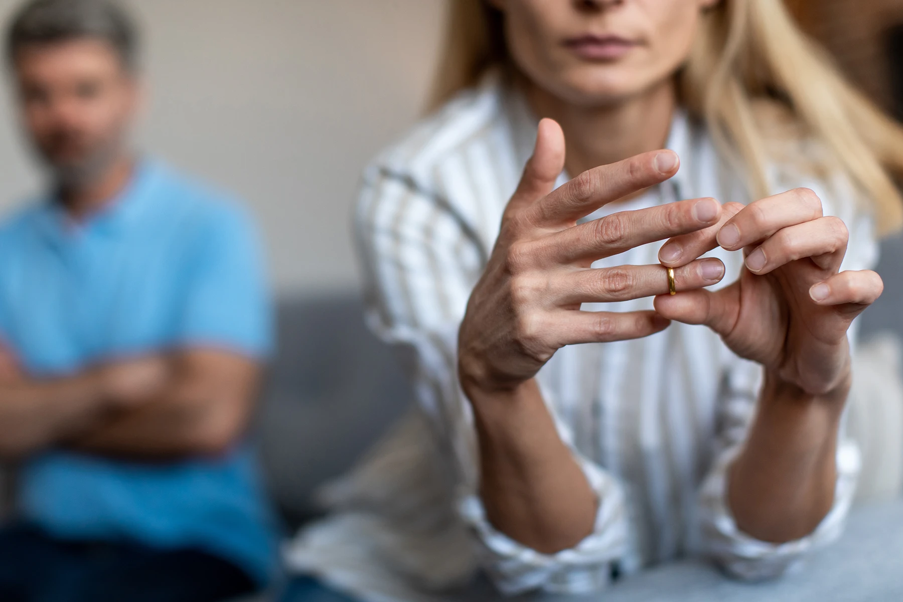 Woman removing her wedding ring - Wilmington, NC divorce lawyer