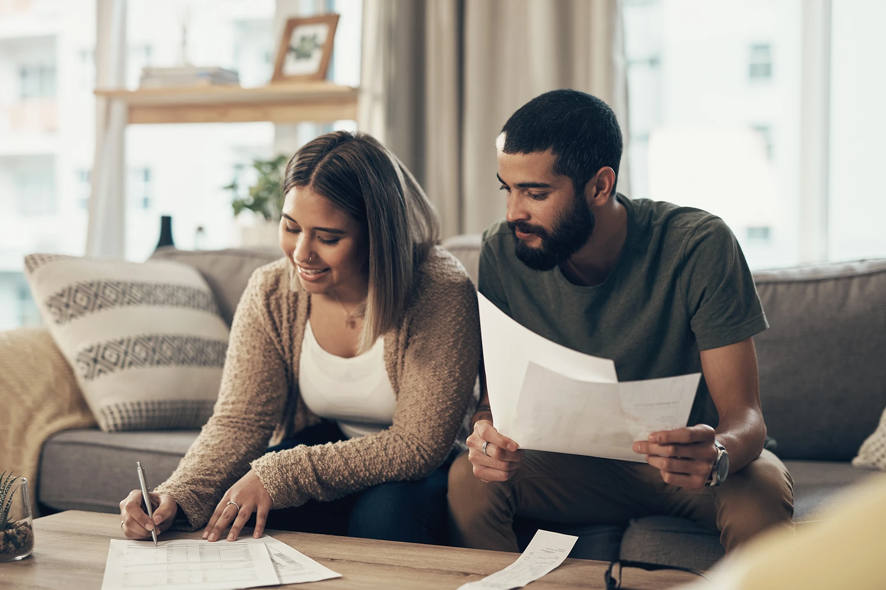 Couple signing a postnuptial agreement - Wilmington, NC postnuptial agreements lawyer
